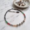 2026/01/2046.jpg "Coral Melon" Black & Textured Red Bead Anklet